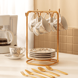 porta xícaras rose com xicaras porcelana e colheres dourados