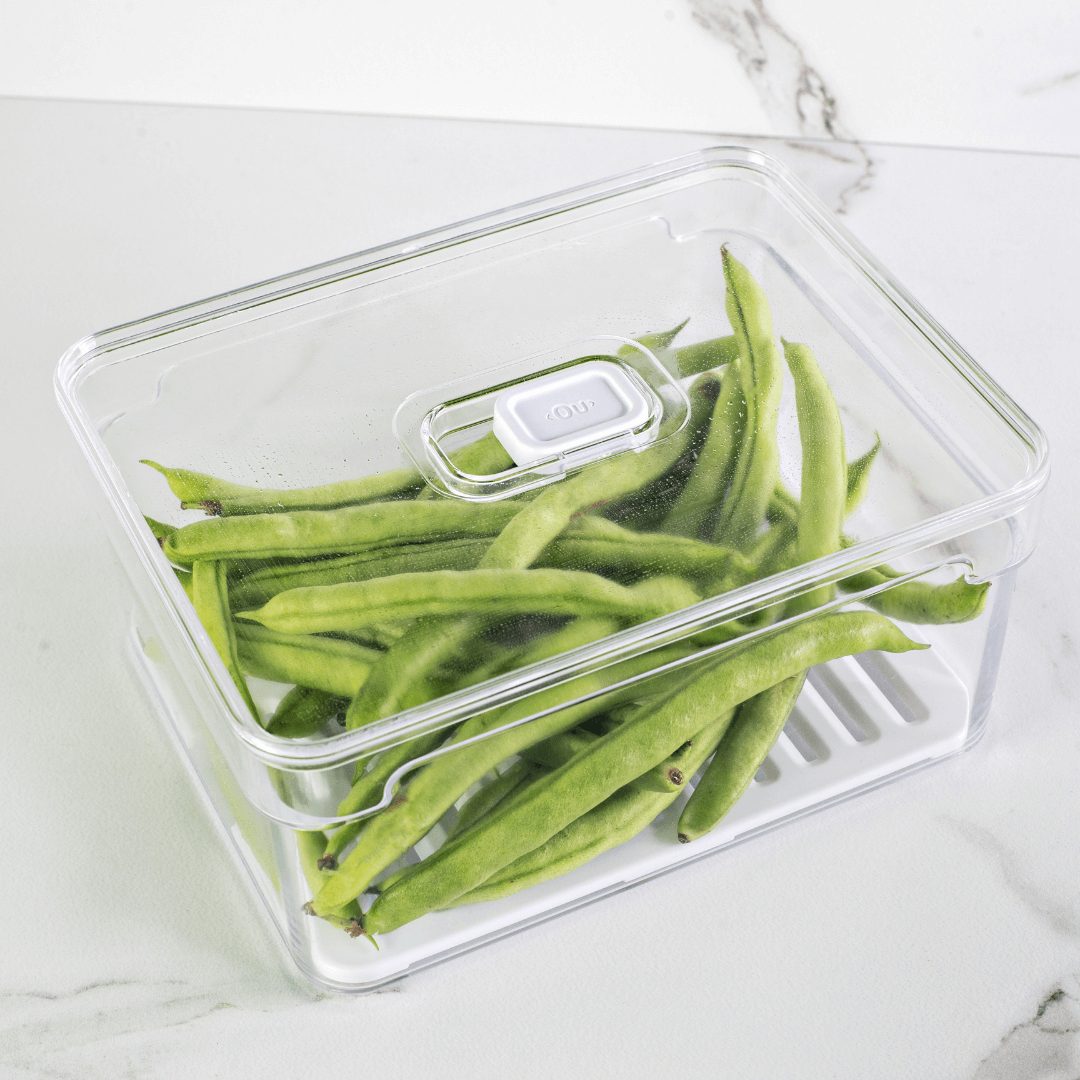 Vagem verde fresca em container com dispositivo Fresh