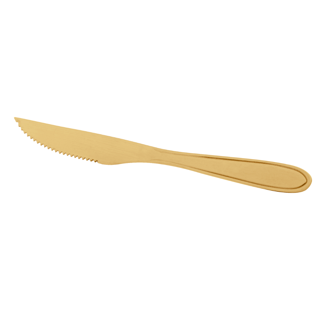 Faca com lâmina serrilhada em aco dourado fundo branco