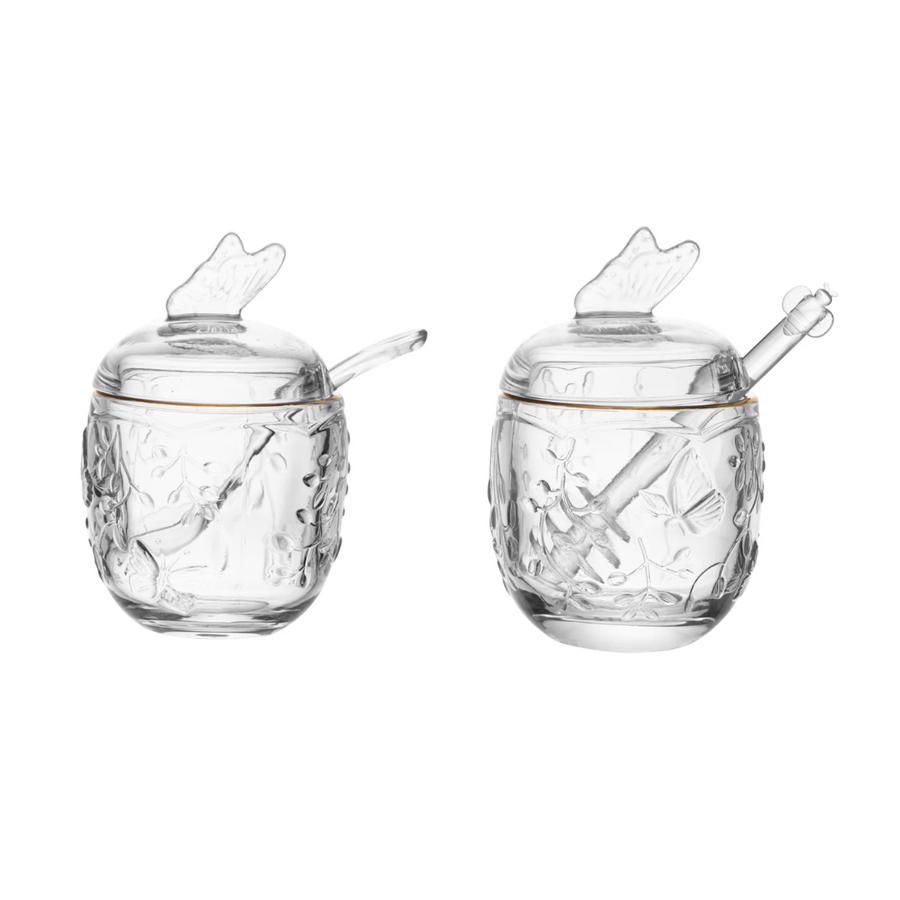 Duas peças do kit de vidro transparente com tampa borboleta e colher