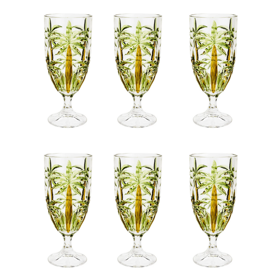 Kit com seis tacas de cristal tropical com relevo de coqueiros em fundo branco